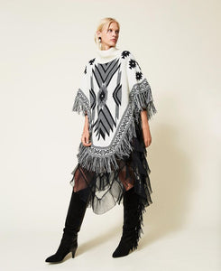 Poncho jacquard con frange